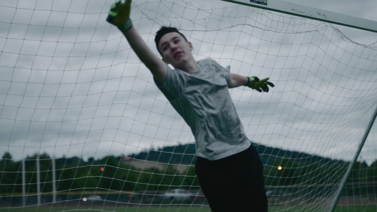 Dawson Riverman diving across his goal, arms outstretched.