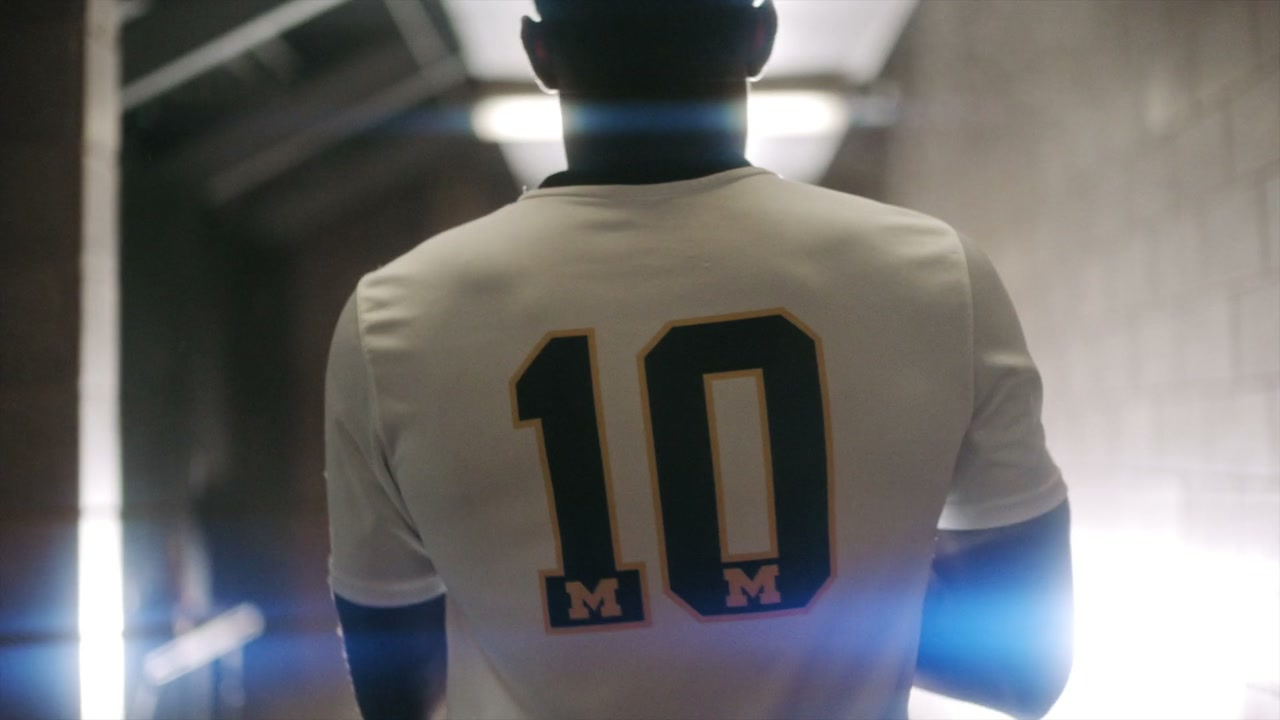 A player walking the tunnel, number ten on his back.